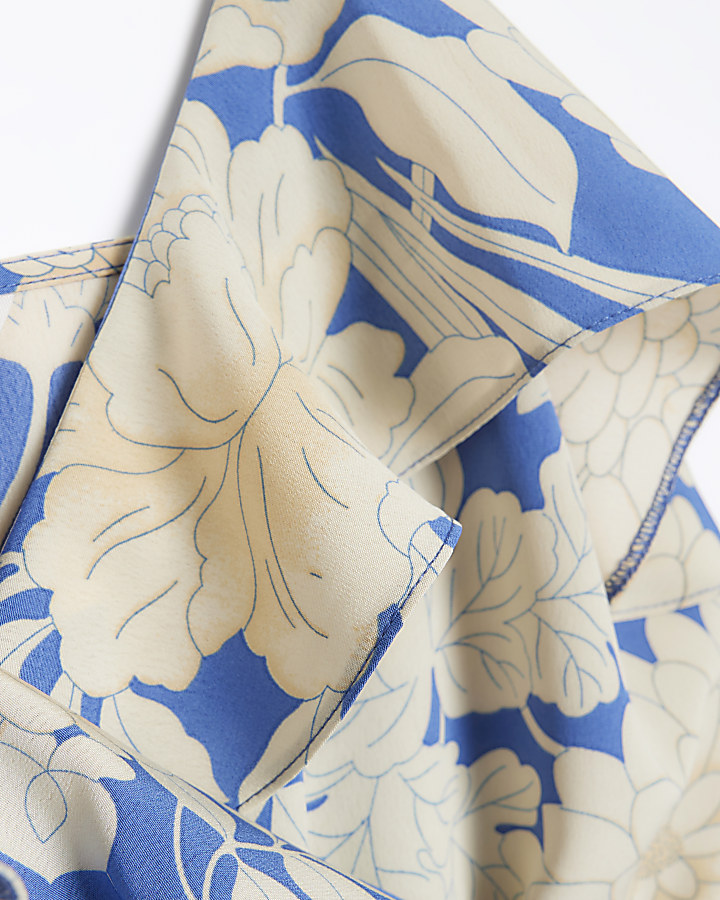 Blue floral frill wrap playsuit | River Island