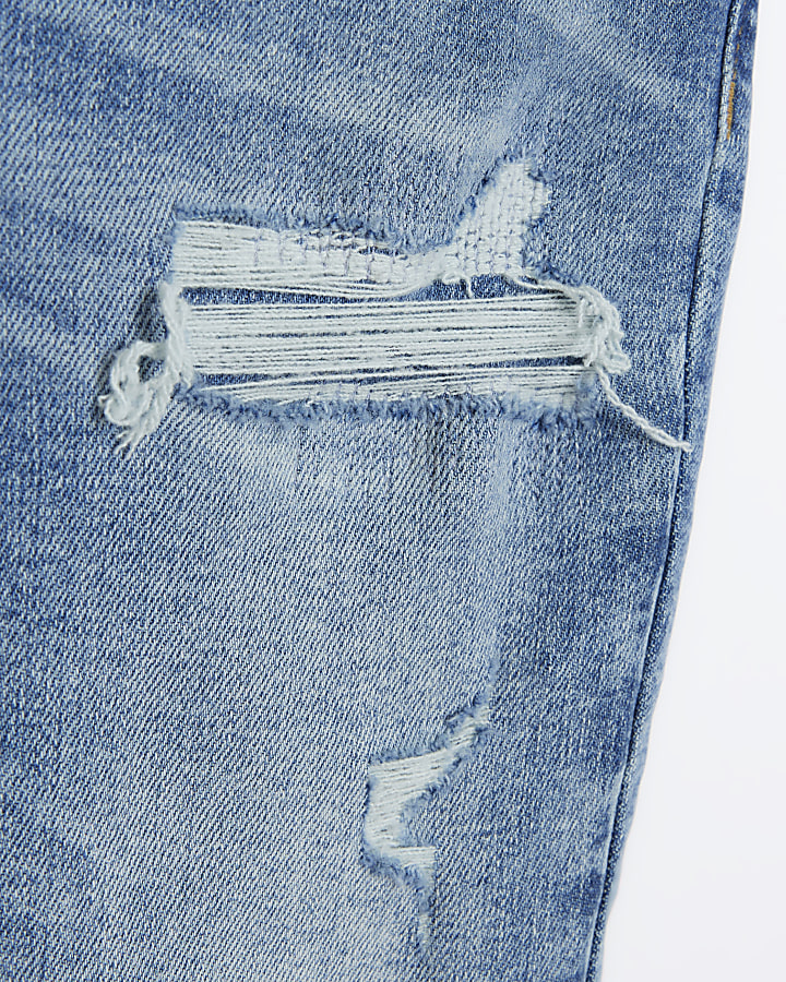 Petite blue high waist skinny ripped jeans | River Island