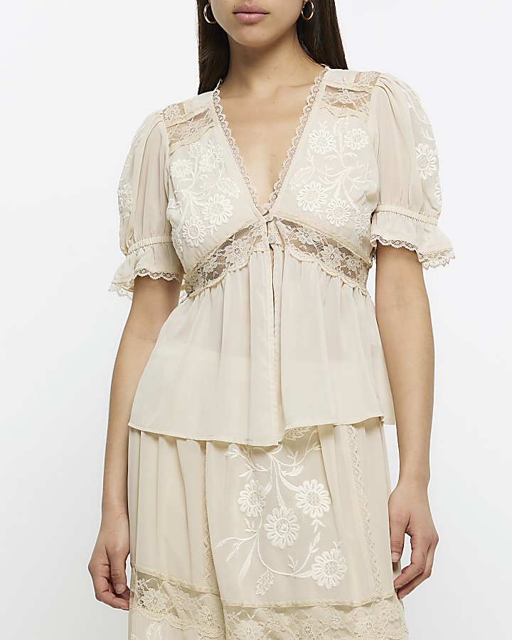 Cream lace embroidered peplum blouse