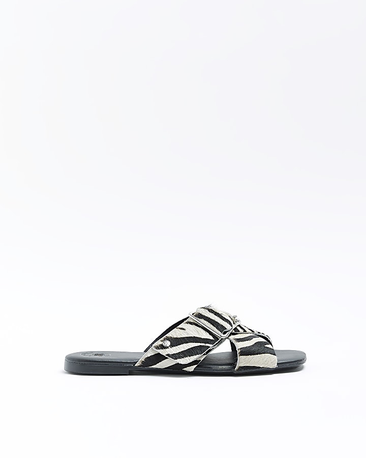 Black animal print flat sandals