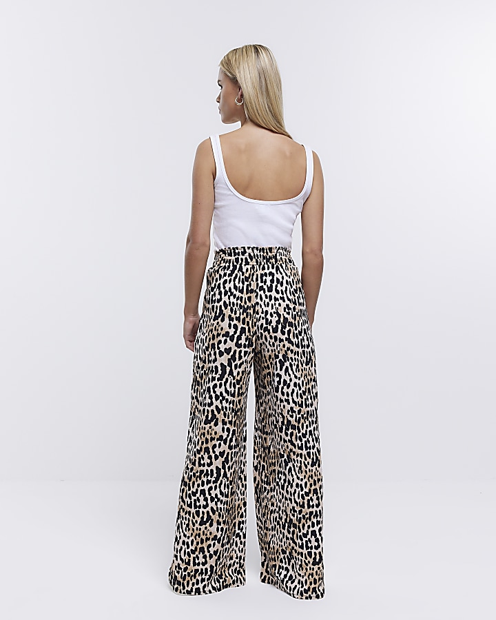 Petite beige leopard print flare trousers