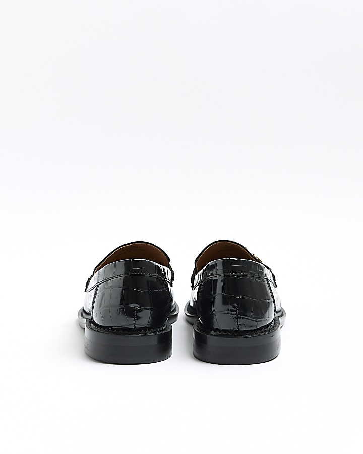 Black studded fringe loafers