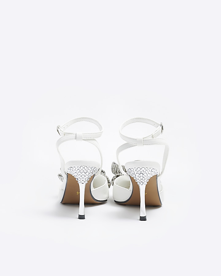 White bow heeled court shoes