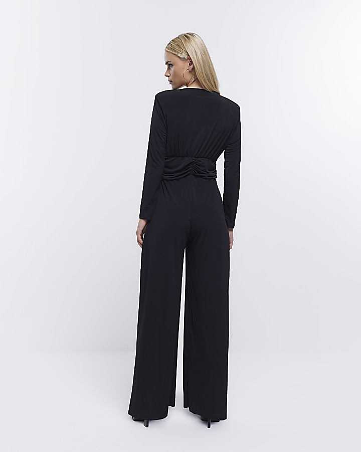 Petite black plunge long sleeve jumpsuit River Island