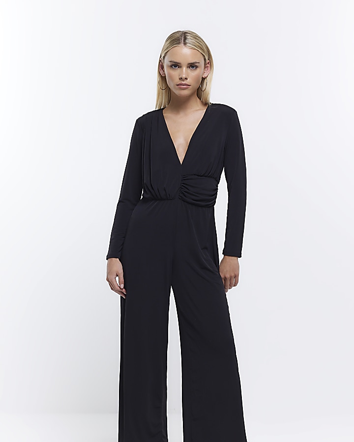 Petite black plunge long sleeve jumpsuit River Island