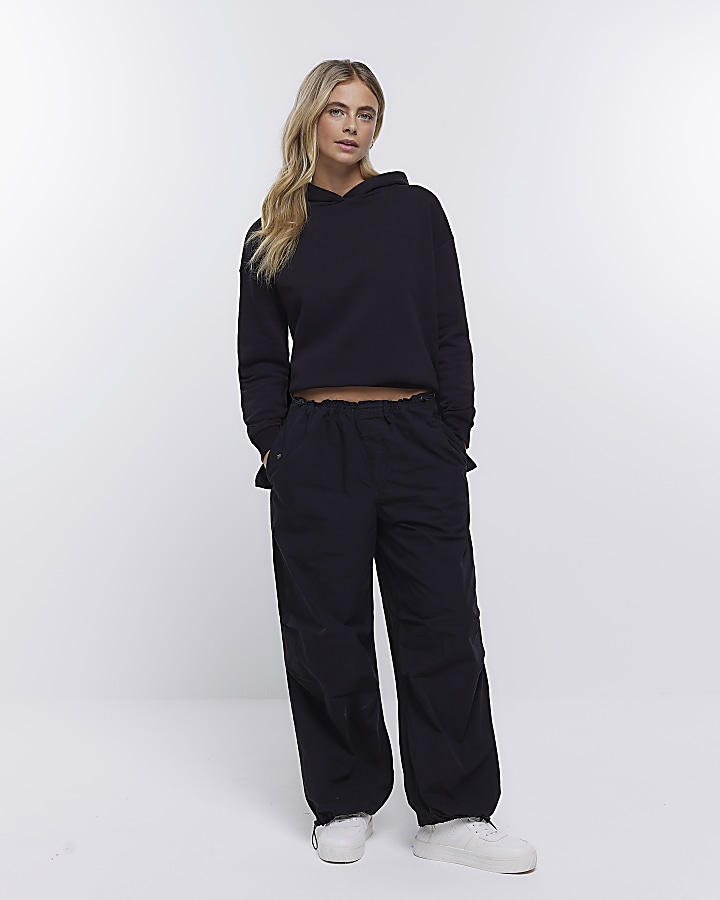 Black low rise parachute trousers River Island