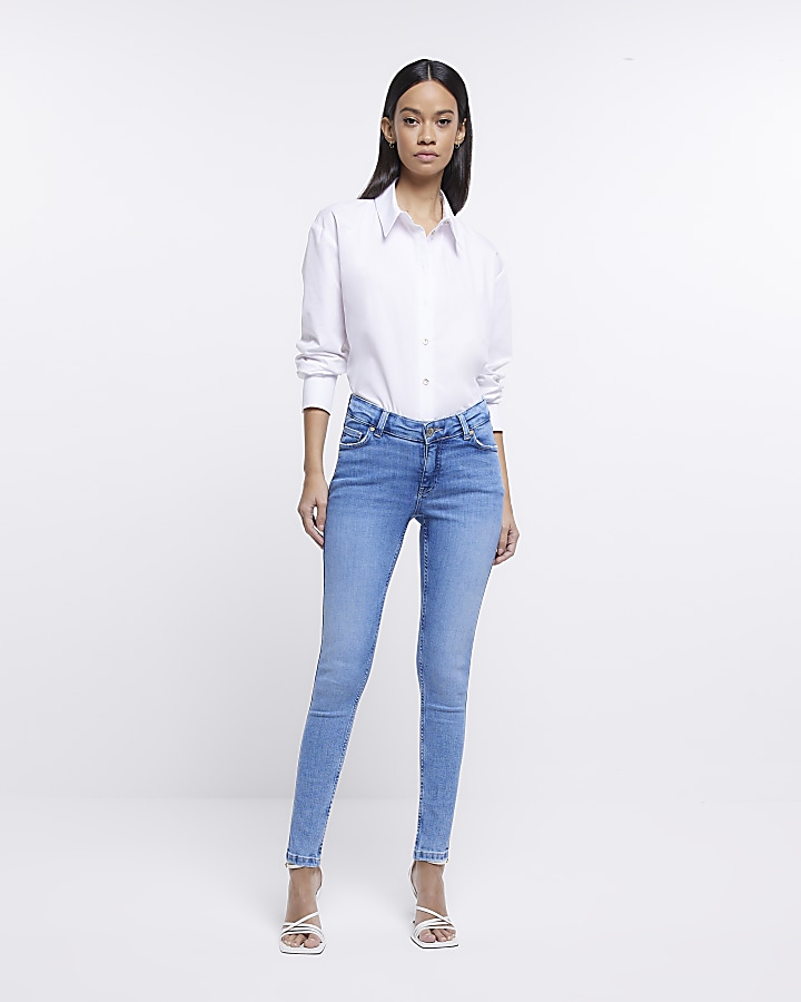 Petite Light Blue Wash Dip Front Low Rise Flared Jeans