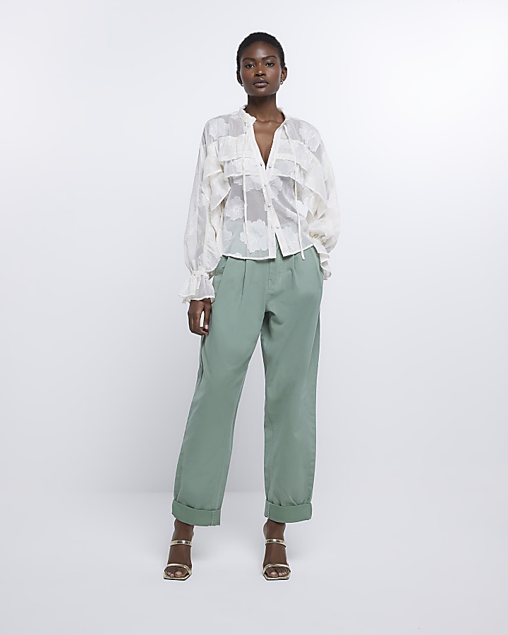 Green pleated chino trousers