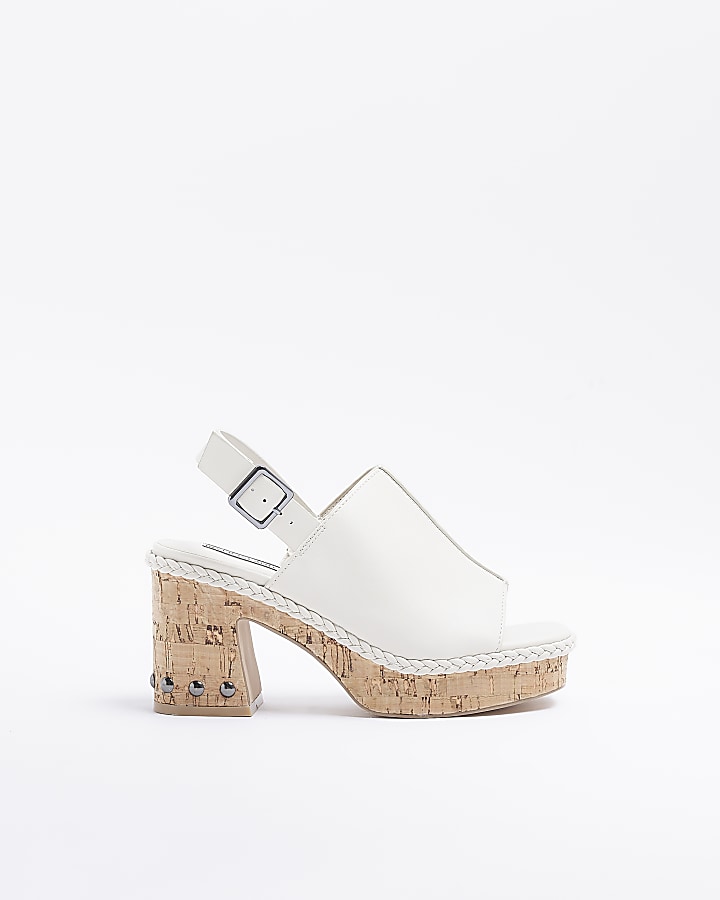 White platform heeled sandals