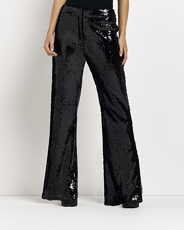 Petite black sequin flared trousers | River Island