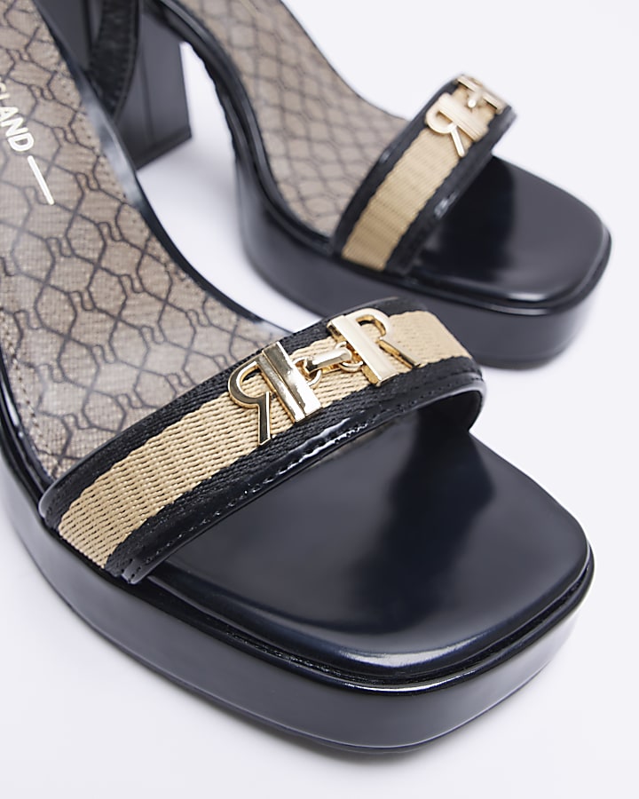 Black patent platform heeled sandals