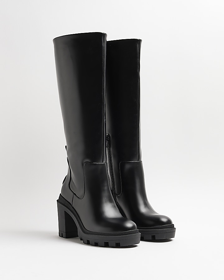 Black heeled knee high boots