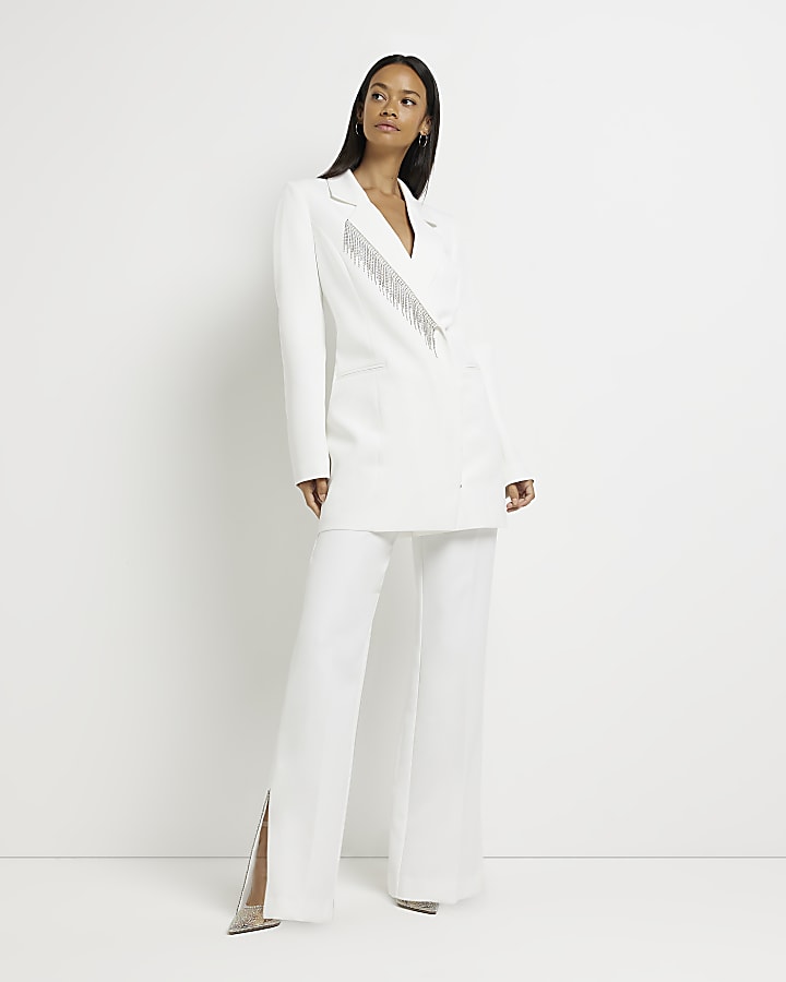 White embellished split hem trousers