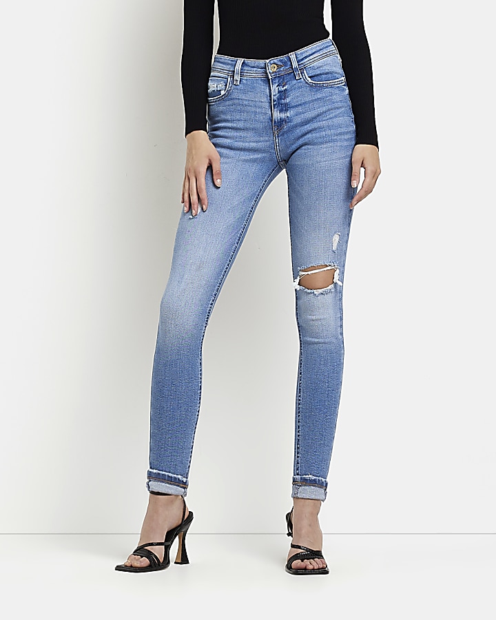 Blue ripped low rise skinny jeans