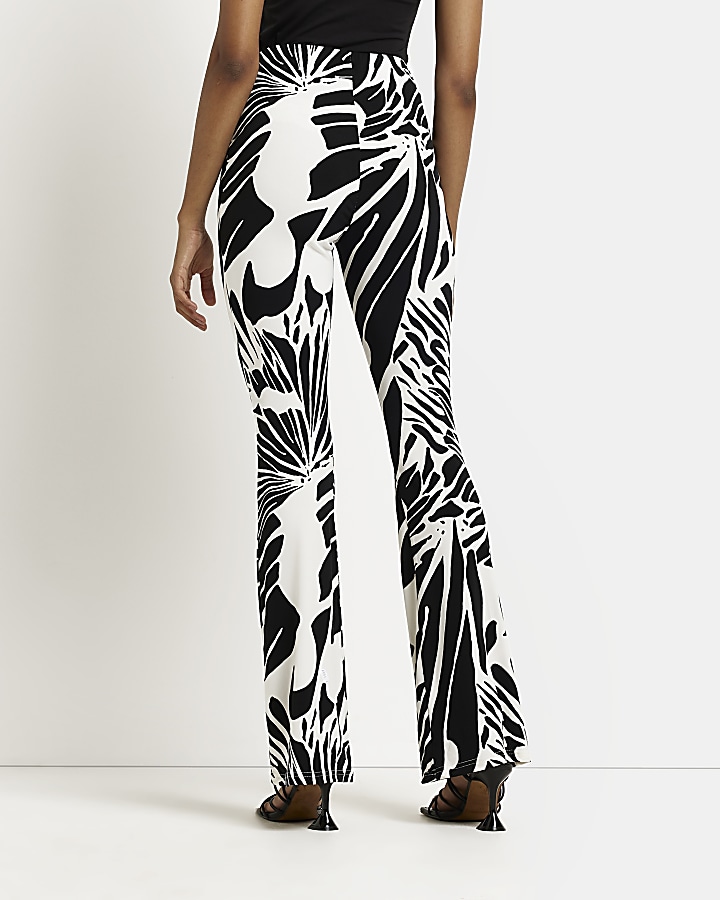 Cream printed flared trousers