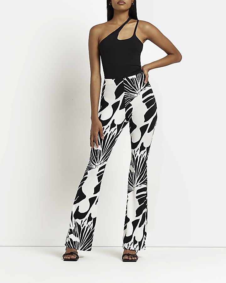 Cream printed flared trousers
