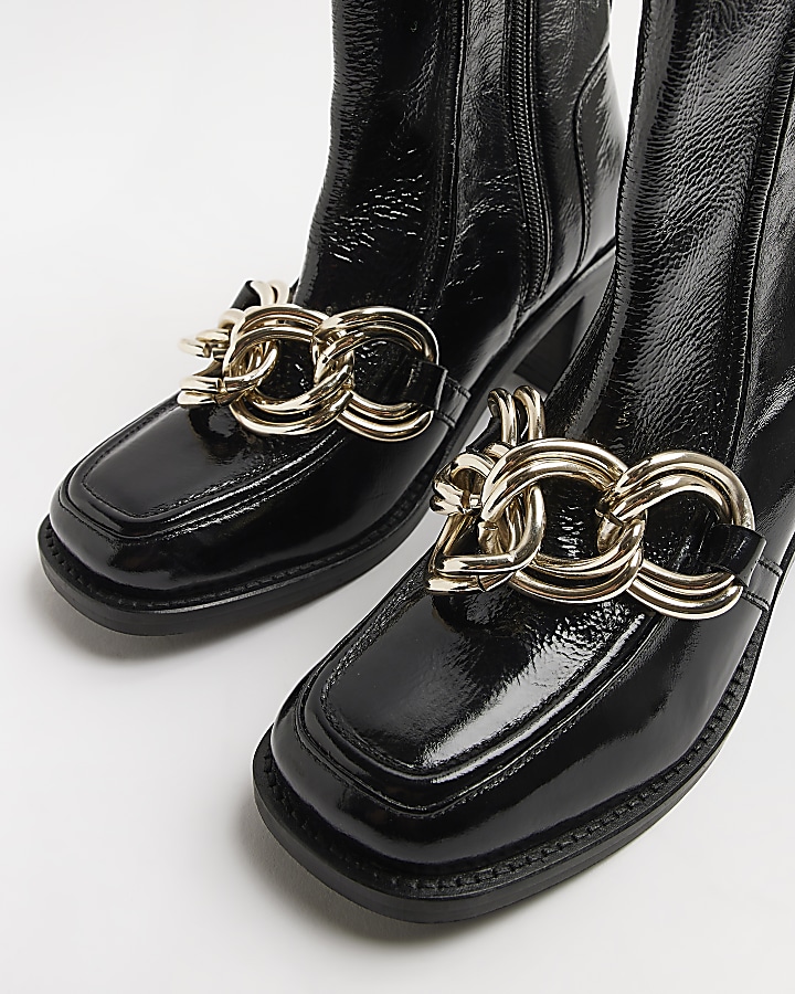 Black leather chain ankle boots