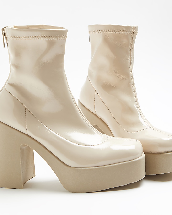Cream patent heeled ankle boots