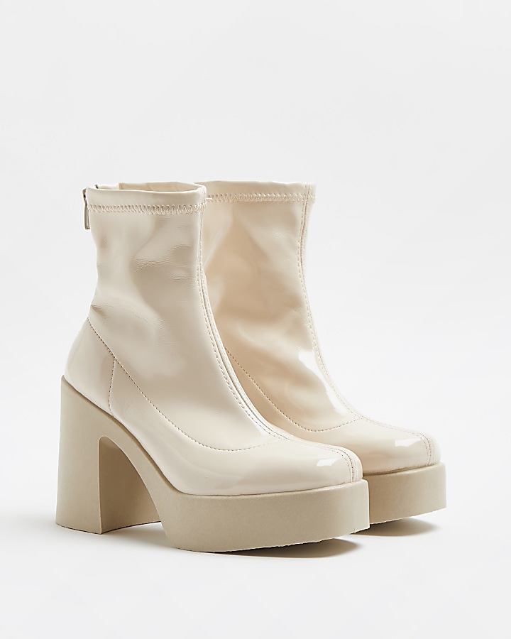 Cream patent heeled ankle boots