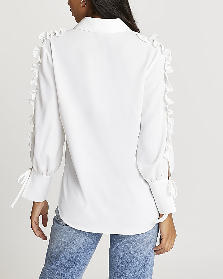 White ruffle long sleeve shirt