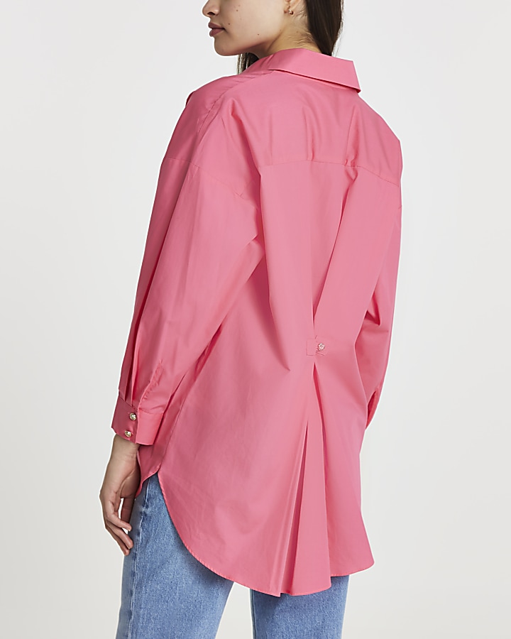 Pink cinched in oversized shirt
