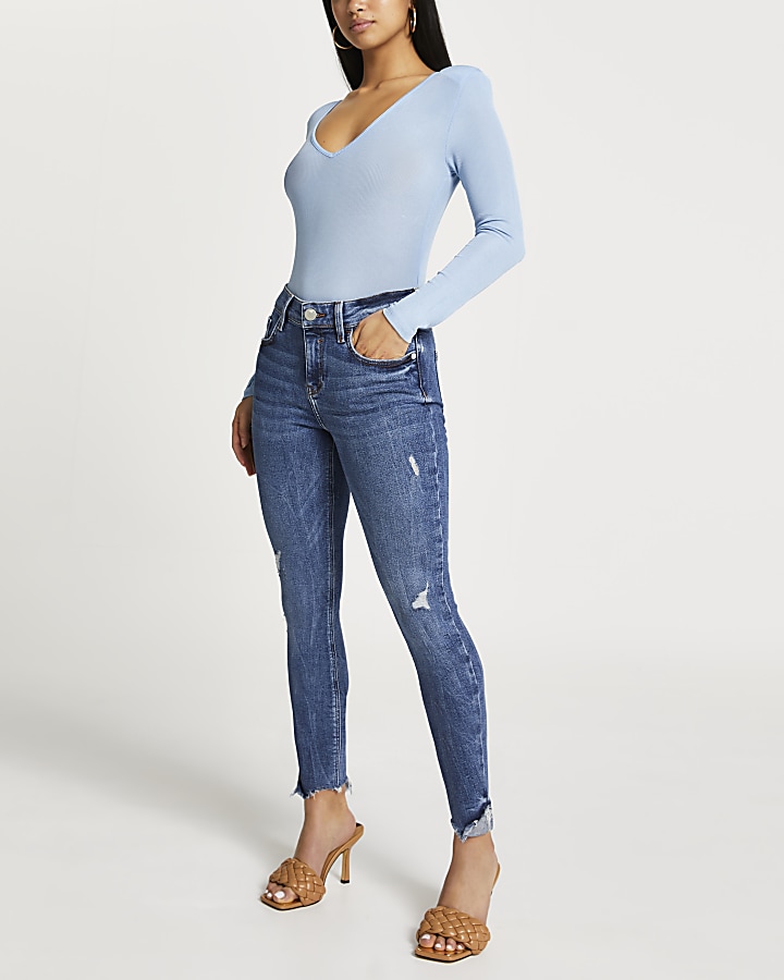 Petite Blue ripped mid rise skinny jeans