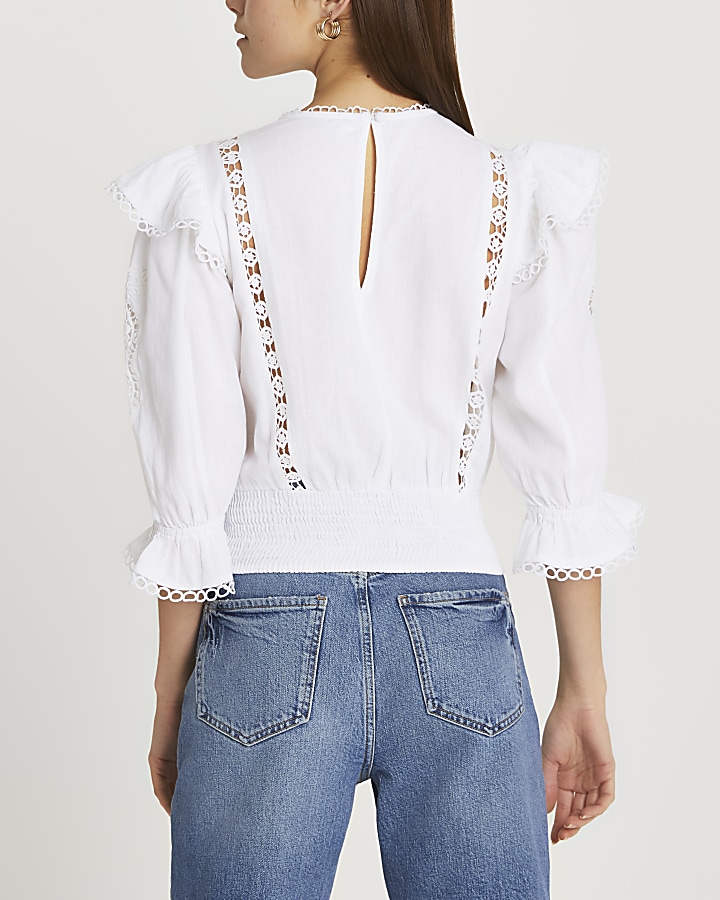 White embroidered frill detail blouse
