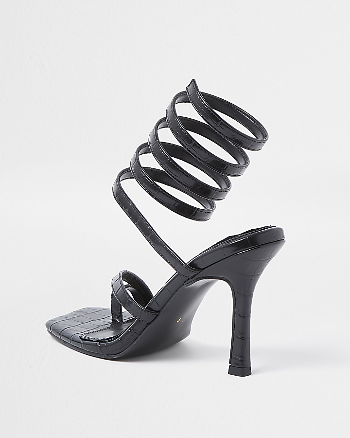 Black faux leather ankle wrap heels