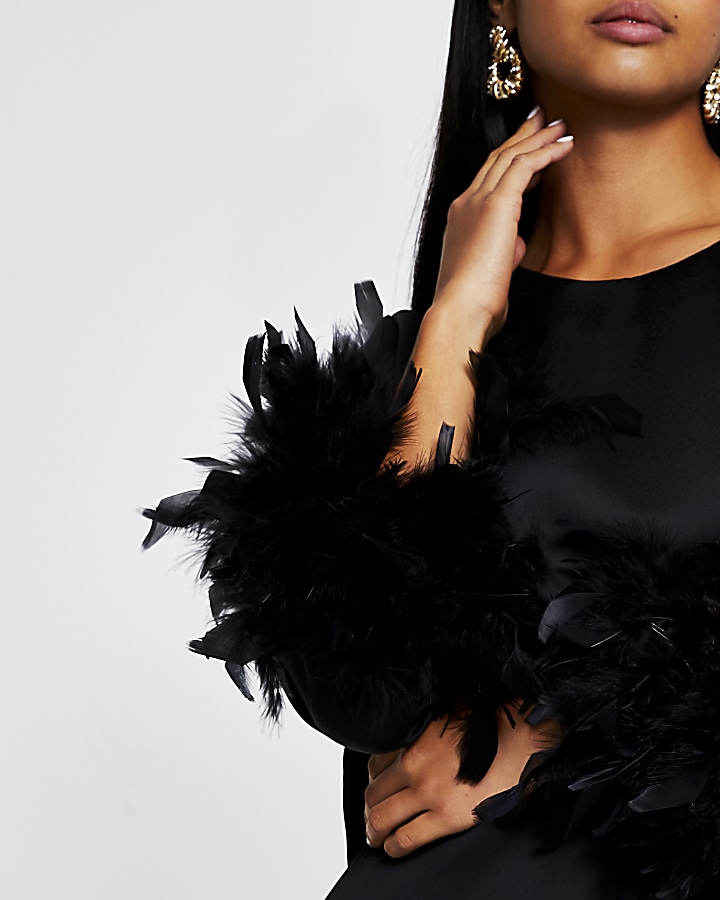 Petite black long sleeve feather cuff top