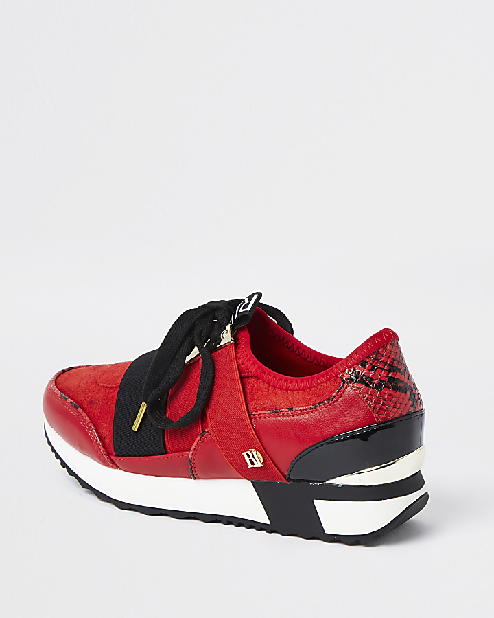 Red lace up runner trainers