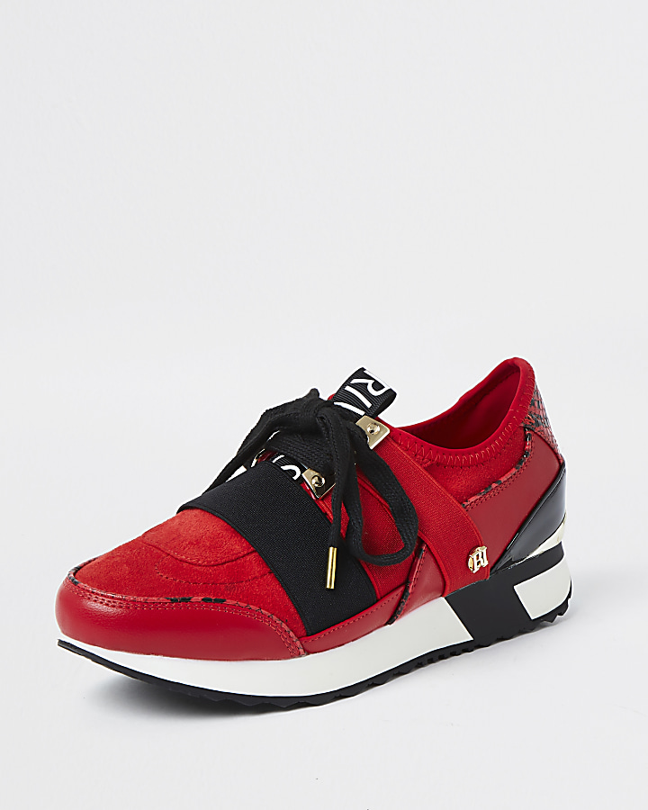 Red lace up runner trainers