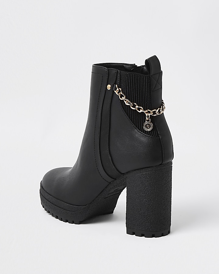 Black ankle boots with chain detail