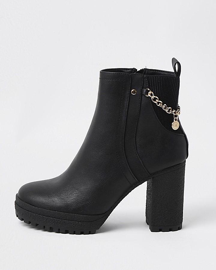 Black ankle boots with chain detail
