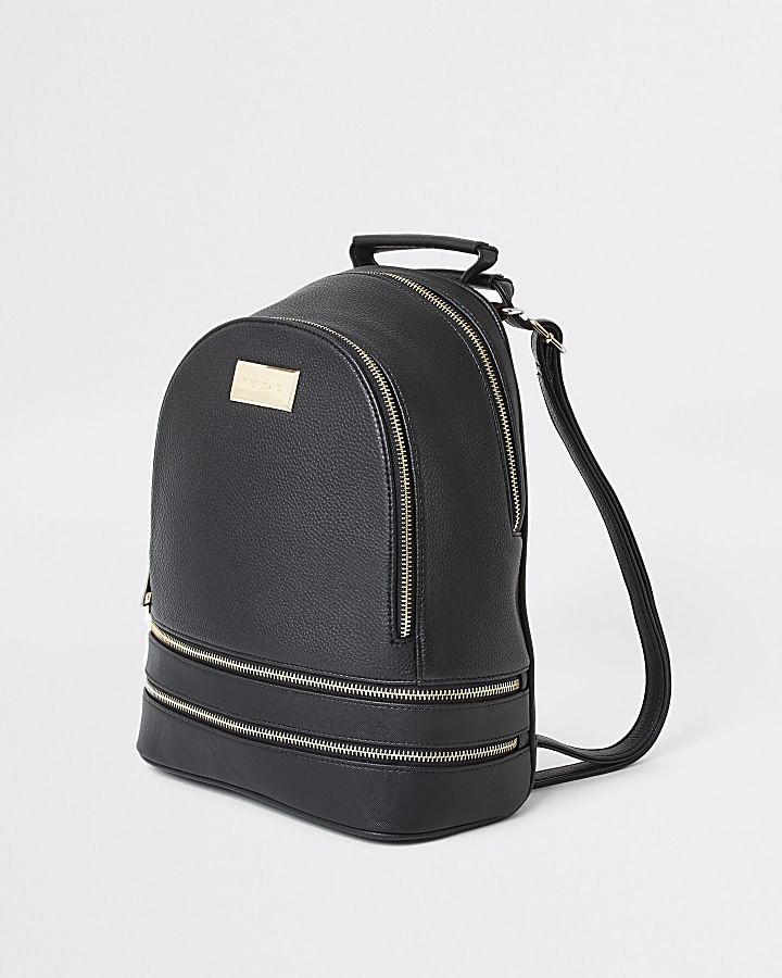 Black faux leather zip bottom backpack