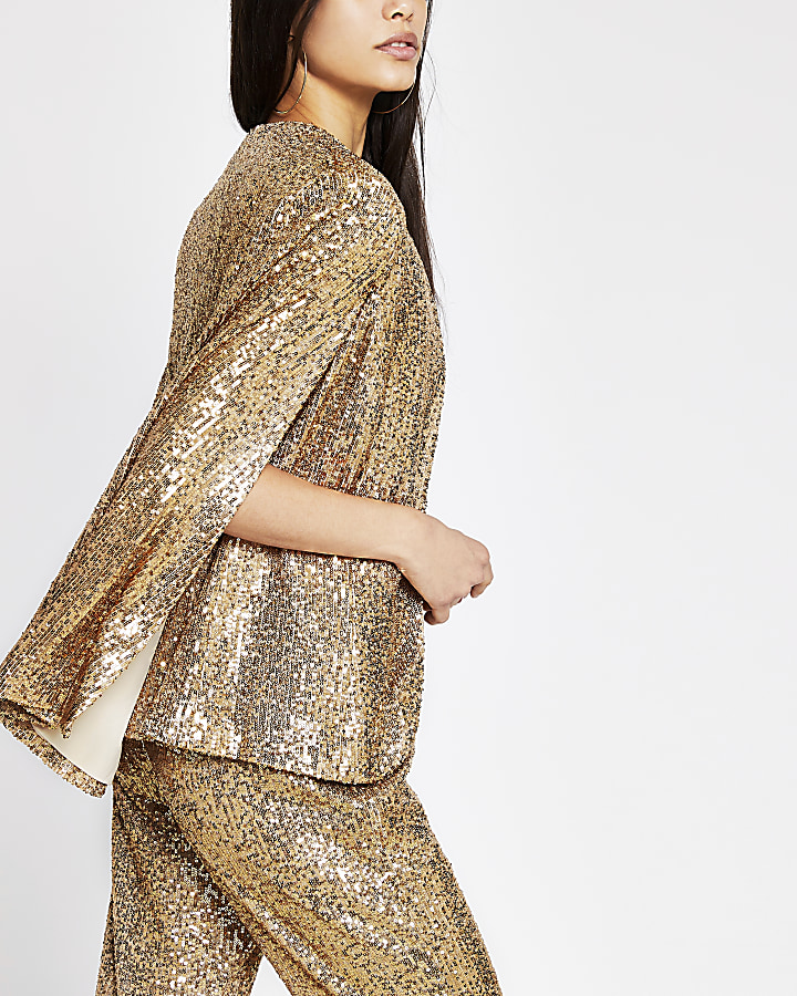 Gold long sleeve sequin embellished cape