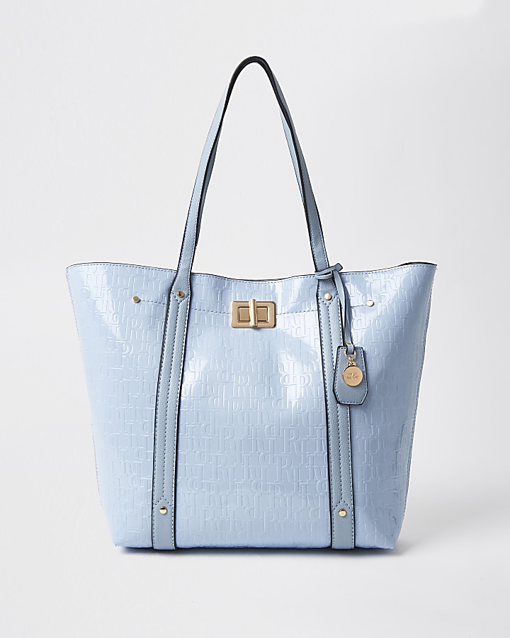 Blue patent RI embossed shopper handbag