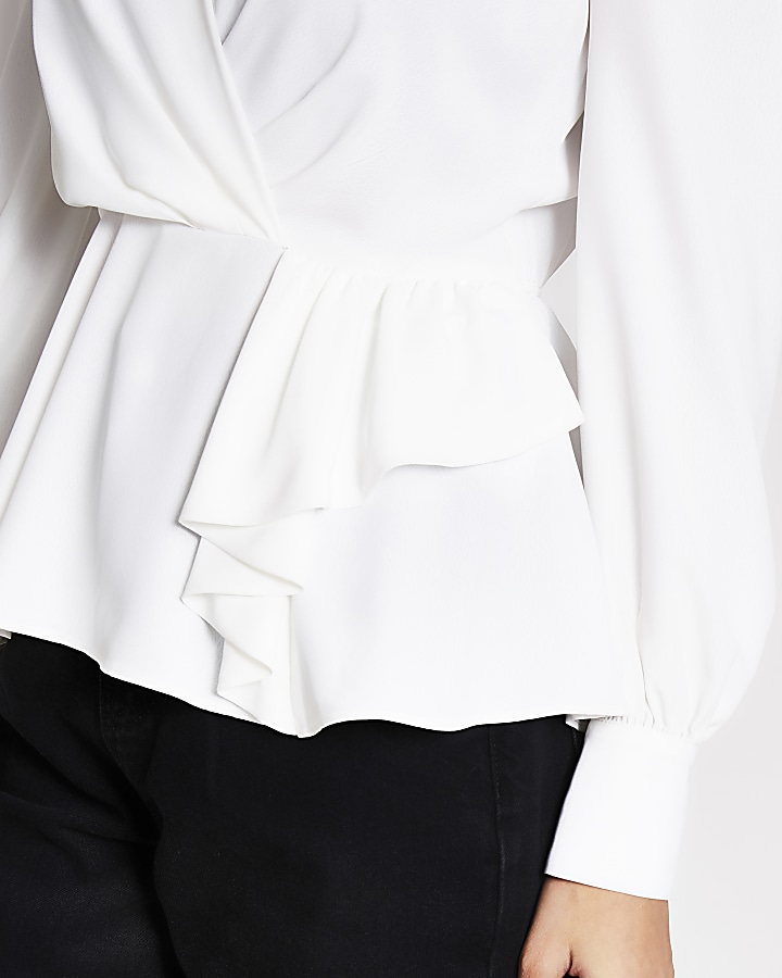 White long sleeve peplum wrap blouse