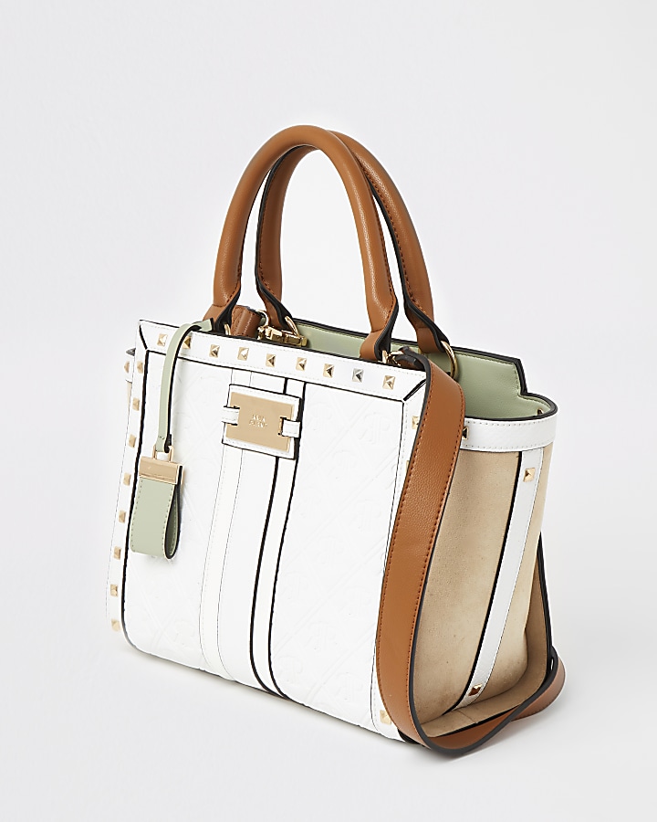 White RI embossed studded tote handbag