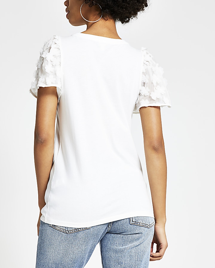 White flower embellished sleeve T-shirt