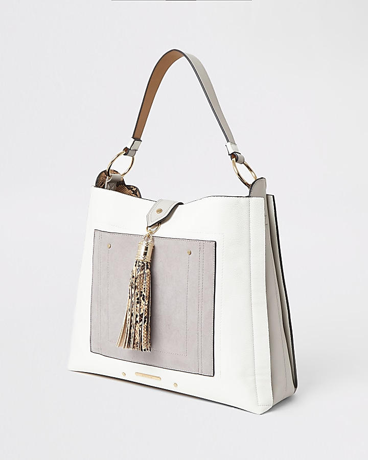 Grey tassel and pocket front slouch handbag