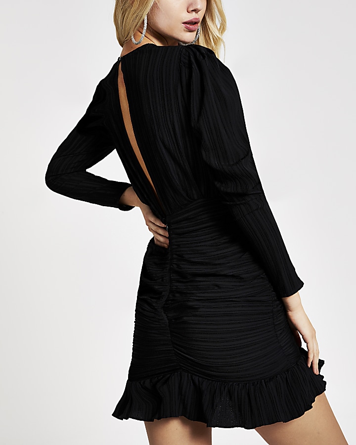 Black textured long sleeve ruched mini dress