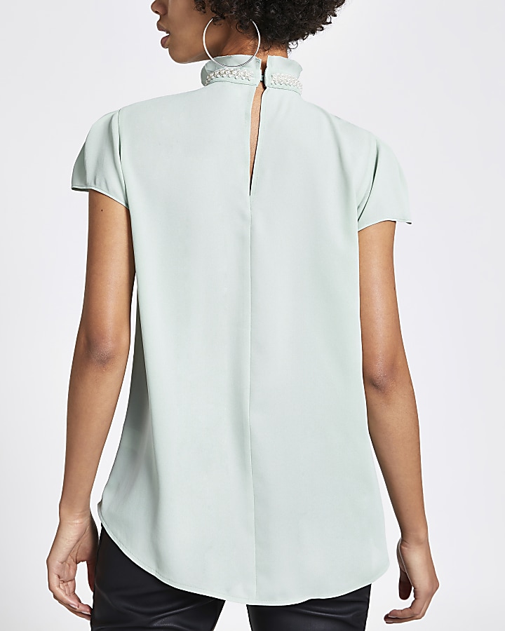 Green pearl neck ruffle front blouse