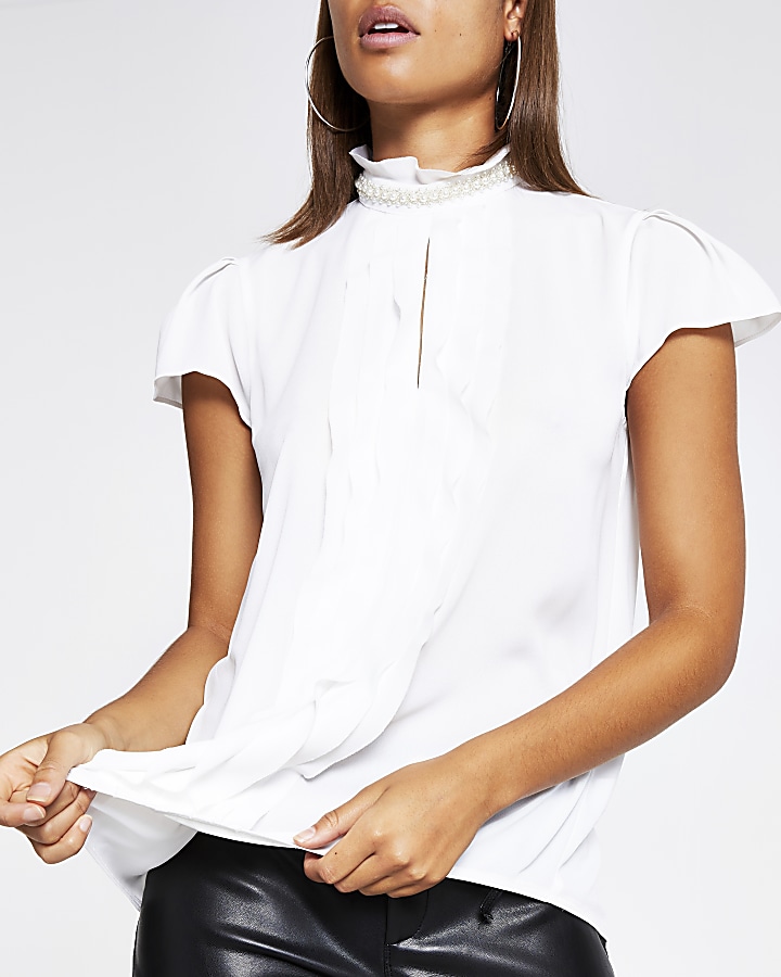 White pearl neck ruffle front blouse