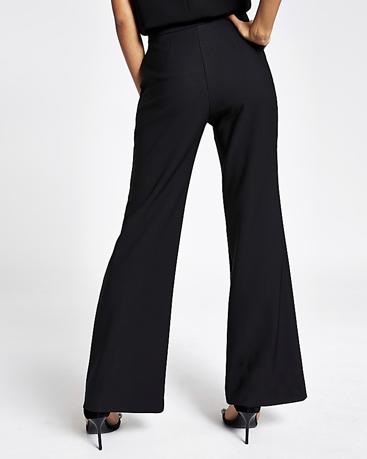 Black flare embellished button trousers