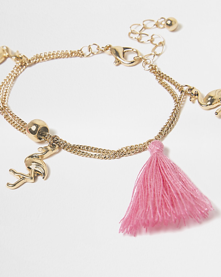 Girls gold tone pink tassel charm bracelet