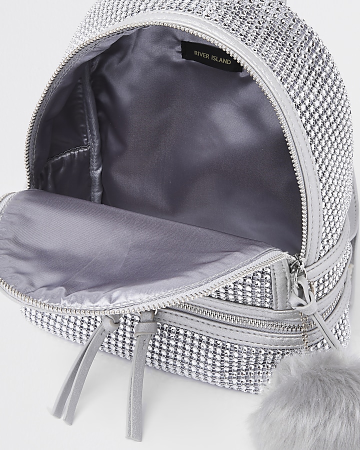 Silver embellished faux fur pom pom backpack