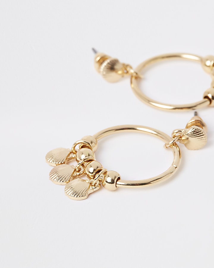 Girls gold tone shell hoop earrings