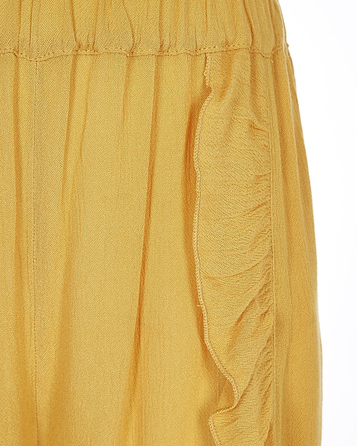 Girls yellow ruffle wide leg trousers