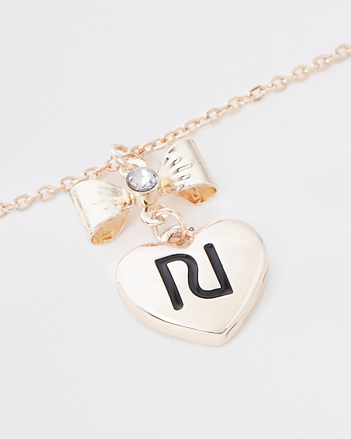 Girls gold colour RI bow necklace