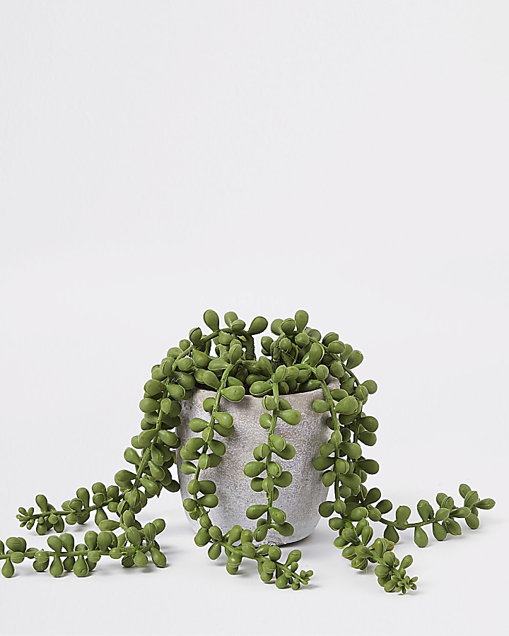 Grey overflowing artificial succulent pot